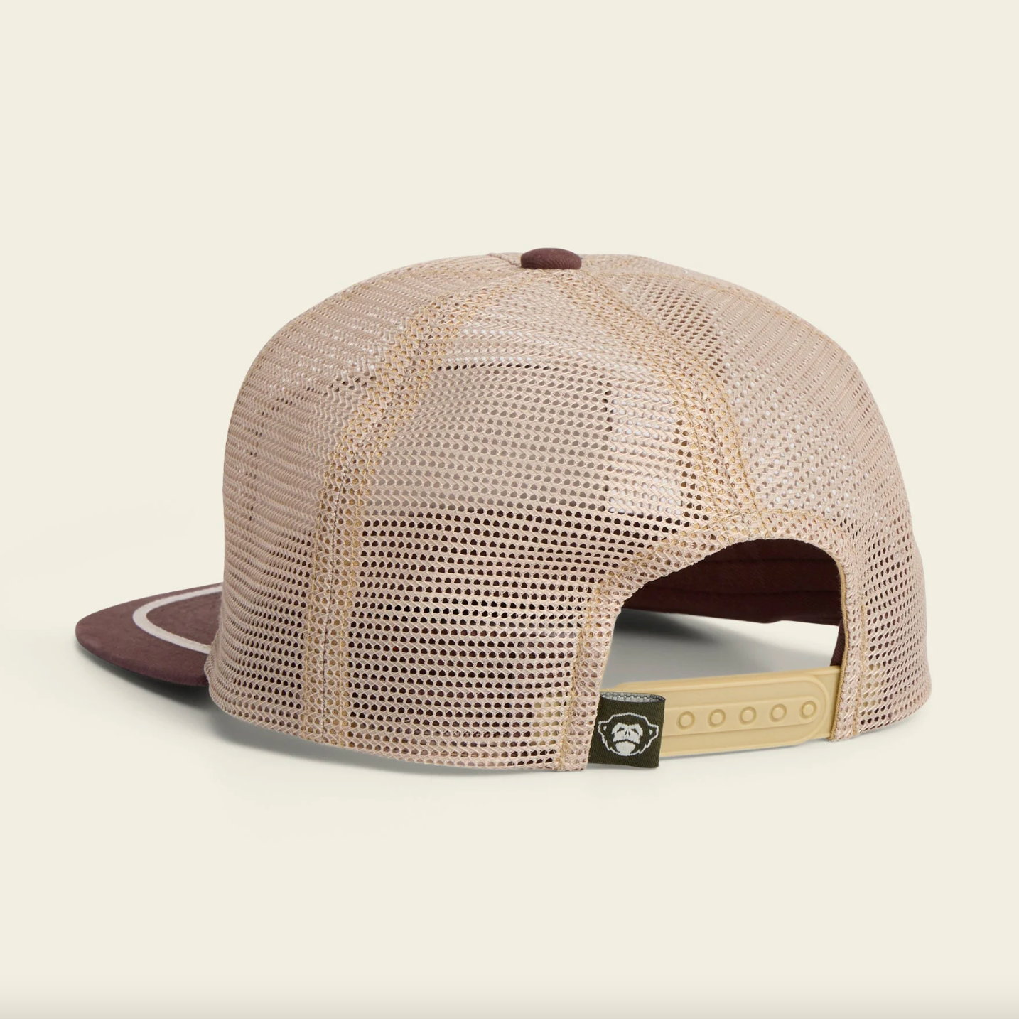 Beige mesh cap with brown visor on a beige background