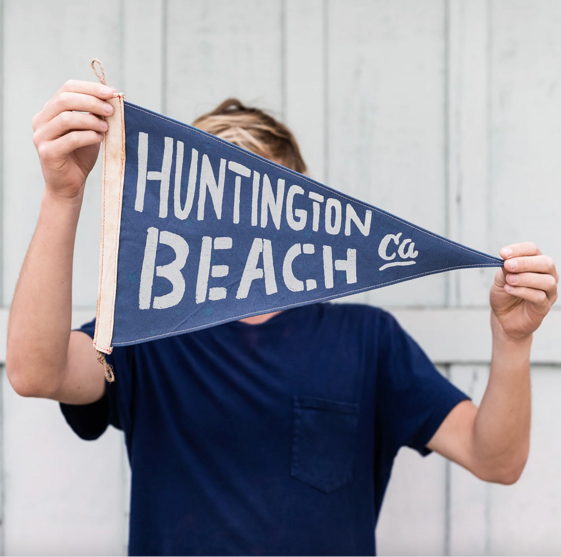 Navy blue pennant with 'Huntington Beach, CA' text on a white background